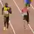 Julian Reus (r.) und Usain Bolt (l.) im 200-Meter-Vorlauf der WM 2015 in Peking. Foto: dpa-pa