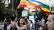 A woman holds a rainbow flag at Gay pride Parade in Jerusalem A woman holds a rainbow flag at Gay pride Parade in Jerusalem