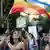  A woman holds a rainbow flag at Gay pride Parade in Jerusalem