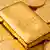 Goldbarren auf Goldmünzen, gold bullion on gold coins