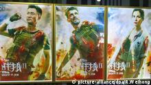 --FILE--A poster of the movie Wolf Warriors 2 is displayed at a cinema in Yichang city, central China's Hubei province, 27 July 2017. Chinese films explode summer box office; Wolf Warriors 2 hits $450 million; Once Upon A Time opens on $60 million. Wu Jing's Wolf Warriors 2 has made history in the Chinese box office as the first film ever to cross $450 million within 11 days. After posting a massive debut of $142 million, the nationalistic action film continued to smash more records in the week of Jul 31-Aug 6, adding $313.62m for an 11-day total of $455.36 million. Its records include earning over $29 million (RMB200 million) daily for 10 consecutive days and surpassing Monster Hunt, Furious 7 and Furious 8 by its 10th day to become the second highest grossing film of all time. Foto: Ren Weihong/Imaginechina/dpa |