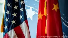 The Chinese and US national flags are seen during a promotional event in Beijing on June 30, 2017. / AFP PHOTO / FRED DUFOUR (Photo credit should read FRED DUFOUR/AFP/Getty Images)