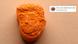 A picture of a police-secured, orange ecstasy pill in the shape of US President Donald Trump's face A picture of a police-secured, orange ecstasy pill in the shape of US President Donald Trump's face