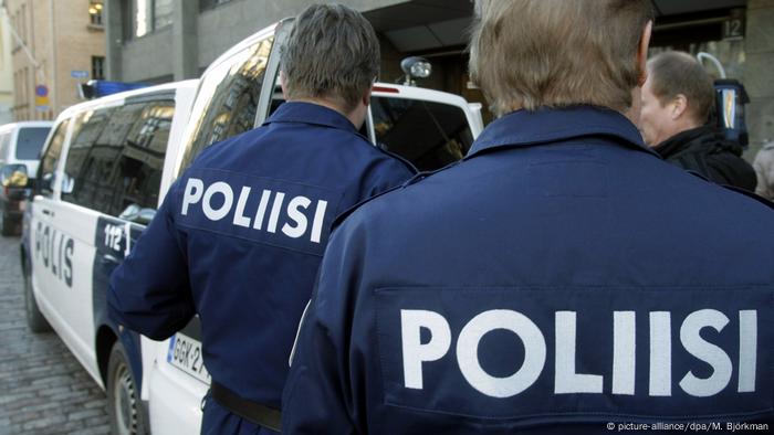 Finnish police officers opening up a police van