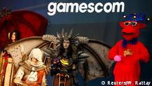 People dressed up as video game characters attend the world's largest computer games fair Gamescom in Cologne, Germany, August 22, 2017. REUTERS/Wolfgang Rattay