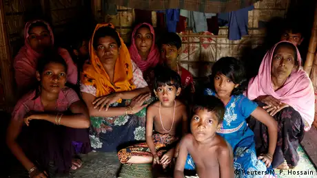 A group of Rohingya refugees takes shelter at the Kutuupalang makeshift refugee camp