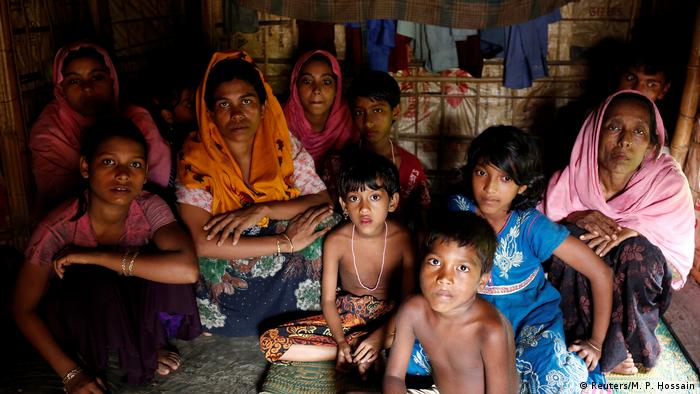 A group of Rohingya refugees takes shelter at the Kutuupalang makeshift refugee camp