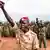 Soldiers from the Sudan People's Liberation Army raise their fists