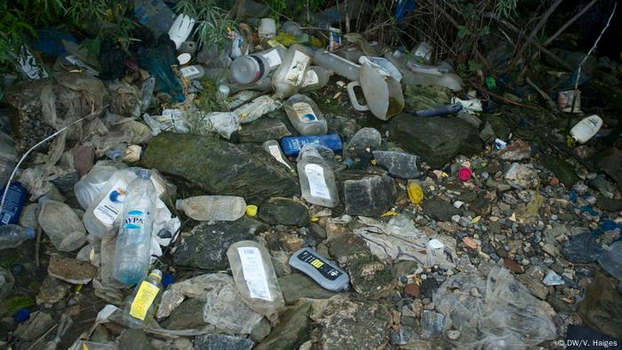 Discarded plastic bottles on the ground outside Moria camp, Lesbos