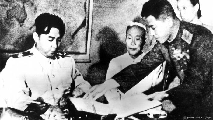 Kim Il Sung signing an armistice after the Korean War, July 1953