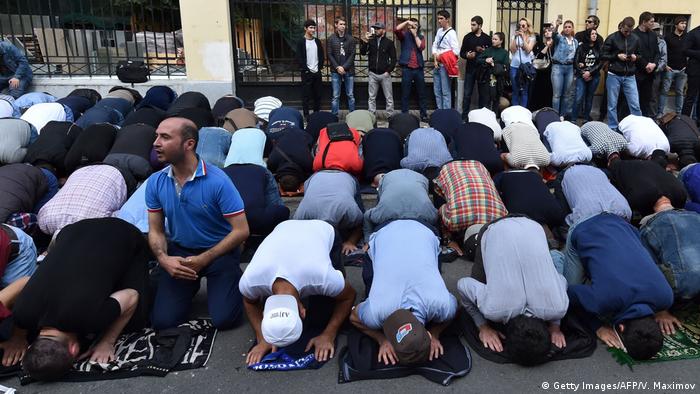 Hundreds of muslims pray in front of the Myanmar embassy in central Moscow