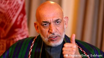 FILE PHOTO - Former Afghan president Karzai speaks during an interview in Kabul