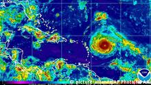 This Monday, Sept. 4, 2017, satellite image provided by the National Oceanic and Atmospheric Administration shows Hurricane Irma nearing the eastern Caribbean. Hurricane Irma grew into a powerful Category 4 storm Monday. (NOAA via AP) |