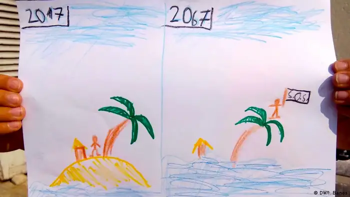 Kids4Climate - Kind zeichnet untergehende Insel (DW/I. Banos)