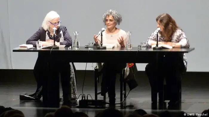 Gabriele von Arnim (left), Eva Matthes (right) and Arundhati Roy (center) on stage