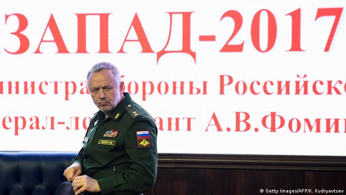 Russia Deputy Defense Minister Alexander Fomin stands in front of a Zapad war games' sign (Getty Images/AFP/K. Kudryavtsev)
