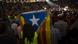 A woman holds an Independence flag ahead of an event promoting the start of the independence campaign in Catalonia A woman holds an Independence flag ahead of an event promoting the start of the independence campaign in Catalonia