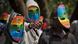 LGBTQ activists in rainbow masks at a protest in Kenya LGBTQ activists in rainbow masks at a protest in Kenya