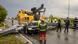 Car on the road crashed by a large traffic sign Car on the road crashed by a large traffic sign