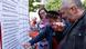 Election campaign event in Cologne: people pointing at issues written on a board Election campaign event in Cologne: people pointing at issues written on a board