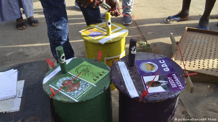 Painted drums with election posters