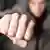 Man holding out clenched fist