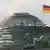 Купол рейхстага, флаг Германии и квадрига на Бранденбургских воротах
