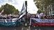 Protesters in Paris march with banners, placards and flags against President Macron's labor reforms. Protesters in Paris march with banners, placards and flags against President Macron's labor reforms.