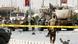 Soldiers secure the area where a suicide car bomb hit a NATO convoy Soldiers secure the area where a suicide car bomb hit a NATO convoy