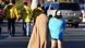 two people from behind who watch police in yellow vests two people from behind who watch police in yellow vests