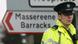 A police officer patrols outside the Massereene army barracks in Antrim, west of Belfast, Northern Ireland, Sunday, March, 8, 2009 after two British soldiers were shot to death and four other people wounded in a drive-by ambush Saturday that politicians blamed on IRA dissidents. A police officer patrols outside the Massereene army barracks in Antrim, west of Belfast, Northern Ireland, Sunday, March, 8, 2009 after two British soldiers were shot to death and four other people wounded in a drive-by ambush Saturday that politicians blamed on IRA dissidents.