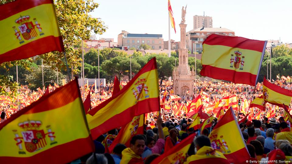 Anti-independence Catalan protestors carry Spanish and catalan flag during  a demonstration for the unity of Spain on the occasion of the Spanish Natio  Stock Photo - Alamy