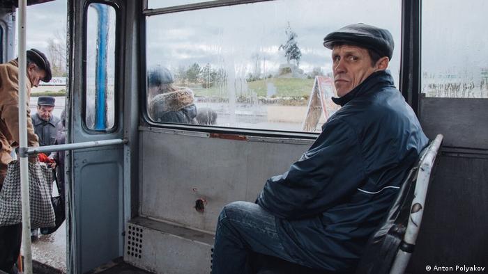 man sitting on a bus