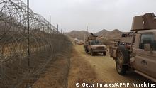 Saudi military vehicles patrol near the Saudi-Yemeni border, in Saudi Arabia's southwestern Jizan province, on April 13, 2015. Saudi Arabia is leading a coalition of several Arab countries which since March 26 has carried out air strikes against the Shiite Huthis rebels, who overran the capital Sanaa in September and have expanded to other parts of Yemen. AFP PHOTO / FAYEZ NURELDINE (Photo credit should read FAYEZ NURELDINE/AFP/Getty Images)