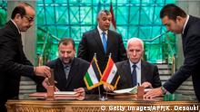 12.10.2017 +++ Fatah's Azam al-Ahmad (R)and Saleh al-Aruri (L) of Hamas sign a reconciliation deal at the Egyptian intelligence services headquarters in Cairo on October 12, 2017, as the two rival Palestinian movements ended their decade-long split following negotiations overseen by Egypt.
The new Hamas deputy leader and the head of Fatah's delegation struck the deal which was described by Palestinian Authority president Mahmud Abbas as a final agreement to end their crippling division, which has at times erupted into deadly conflict over the past ten years. / AFP PHOTO / KHALED DESOUKI (Photo credit should read KHALED DESOUKI/AFP/Getty Images)