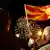 Supporters of the ruling Social Democratic Union of Macedonia wave a Macedonian flag during victory celebrations for the local elections