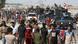 Iraqi civilians gather as Iraqi forces arrive in the first neighbourhood on the southern outskirts of Kirkuk Iraqi civilians gather as Iraqi forces arrive in the first neighbourhood on the southern outskirts of Kirkuk