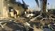 Security forces inspect the site of a suicide attack at a police training center Security forces inspect the site of a suicide attack at a police training center