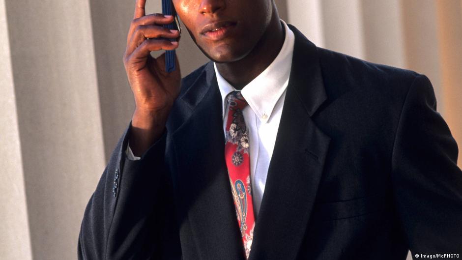 Photo: DW Male business man talking on the phone
