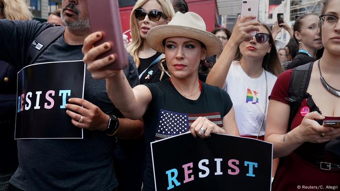 Alyssa Milano (Mi) and other women with Resist signs