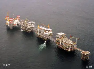 ** FILE ** A five-platform complex pumps crude off the coast of Cabinda, Angola's most prolific oil field in this Friday, July 12, 2002 file photo. Angola is joining OPEC, African oil exploration is booming and China is investing. The stampede for African oil has continued, even as militant attacks in some countries and precarious governments in others make returns uncertain. (AP Photo/Bruce Stanley, File)