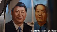 This photo taken on September 19, 2017 shows painted portraits of Chinese President Xi Jinping (L) and late communist leader Mao Zedong at a market in Beijing.
As the Chinese Communist Party gathers for its most defining congress in decades, a new catchphrase is echoing through Beijing's cavernous Great Hall of the People: Xi Jinping's new era thought. / AFP PHOTO / GREG BAKER (Photo credit should read GREG BAKER/AFP/Getty Images)