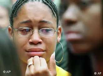 Baylor University freshman Keshia Neal, of Georgetown,Texas, cries during a silent march against racism, Friday, Nov. 14, 2008, in Waco Texas. About 150 students gathered across the campus in wake of the alleged racial incidents on Election Day where a rope resembling a noose was found hanging from a tree. On Thursday, Baylor's Interim President David Garland announced that the rope turned out to be a discarded rope swing and was not a noose. (AP Photo/Waco Tribune Hearld, Rod Aydelotte)