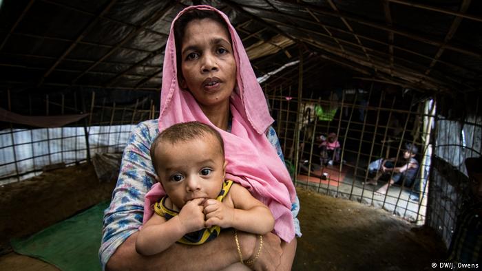 Rohingya mother holding a child