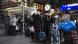 Lines of people wait outside a Deutsche Bahn service point at Hamburg's main train station following Storm Herwart Lines of people wait outside a Deutsche Bahn service point at Hamburg's main train station following Storm Herwart