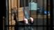 THe murder suspect hides his face THe murder suspect hides his face
