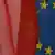 the flags of Poland and the EU