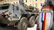 Soldier wearing a Franco-German brigade patch in front of a tank Soldier wearing a Franco-German brigade patch in front of a tank