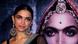Deepika Padukone posing in front of a large movie poster Deepika Padukone posing in front of a large movie poster