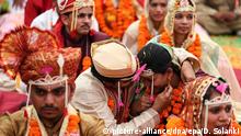 epa05125047 Indian bridal couples are seen during a mass marriage ceremony at Kharghar on the outskirts of Mumbai, India, 25 January 2016. According to reports, 145 couple tied their nupital knot at the mass wedding function organized by Sant Nirankari Mandal during the 49th annual Nirankari Sant Samagam of Maharashtra in the presence of spiritual Guru His Holiness Baba Hardev Singh Ji Maharaj (not seen). EPA/DIVYAKANT SOLANKI |